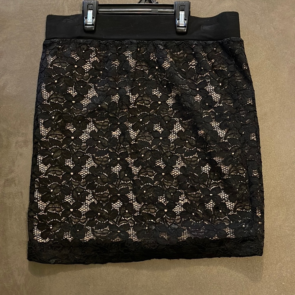 Black lace skirt with nude underlying fabric